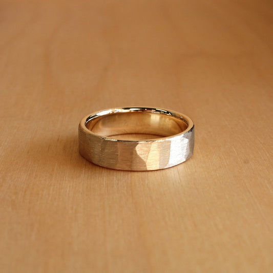 Gold ring on a wooden surface