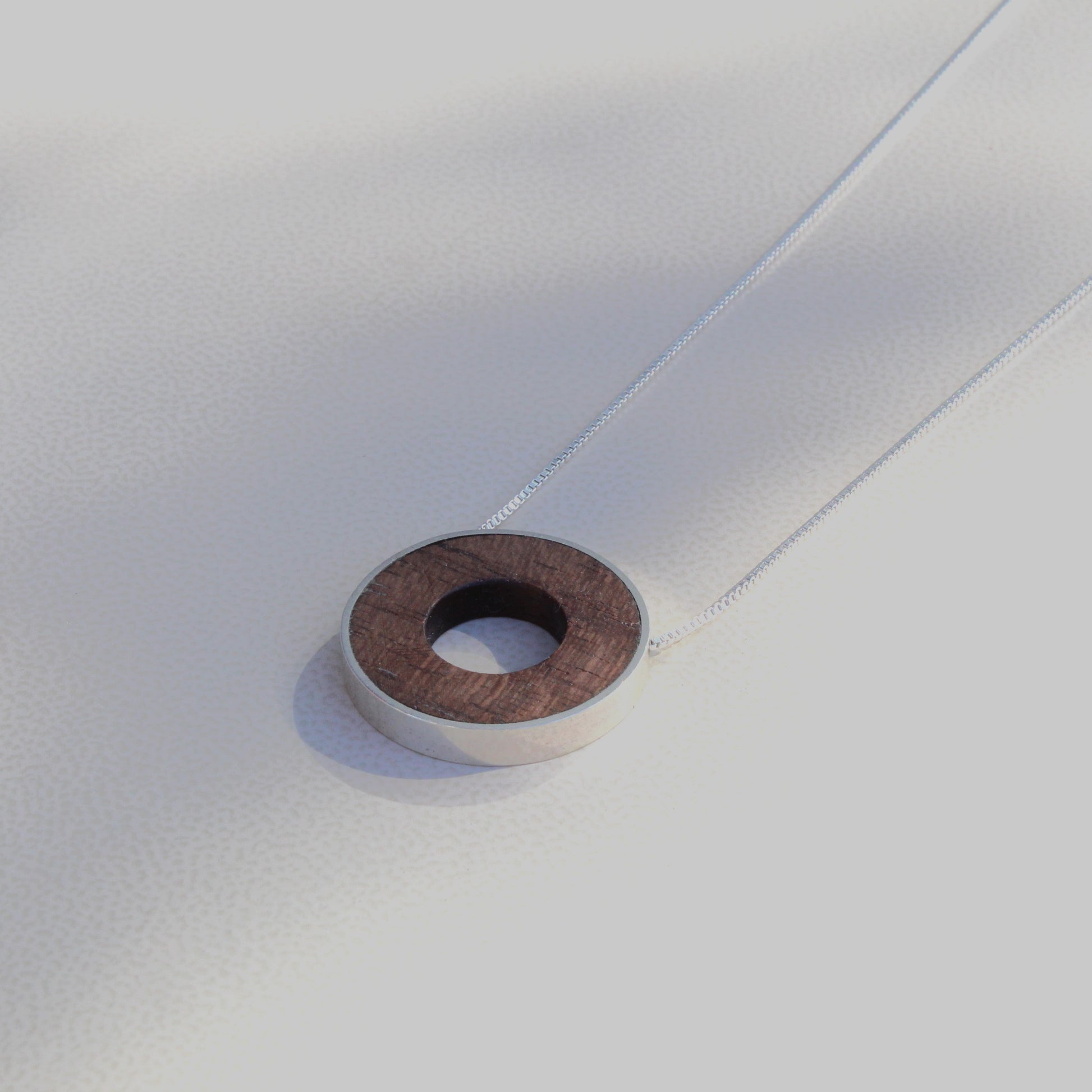 walnut wood circular pendant with silver chain