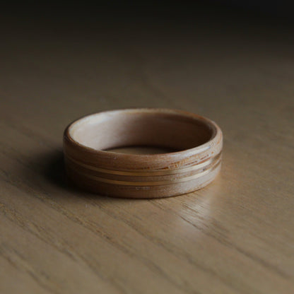 Wooden ring with yellow gold inlays