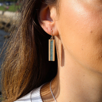 blue glass earrings on model