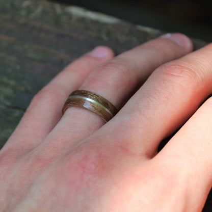 Walnut ring with silver inlay