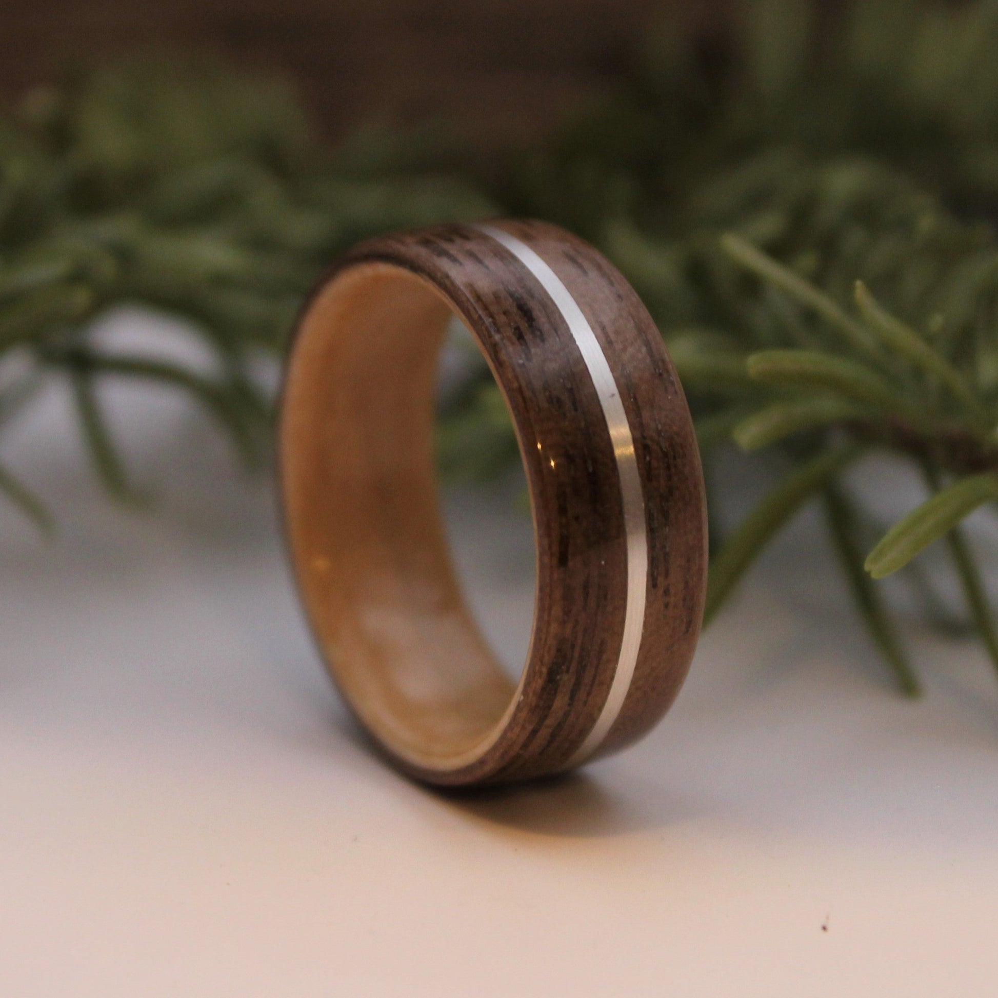 Walnut wood ring with silver inlay